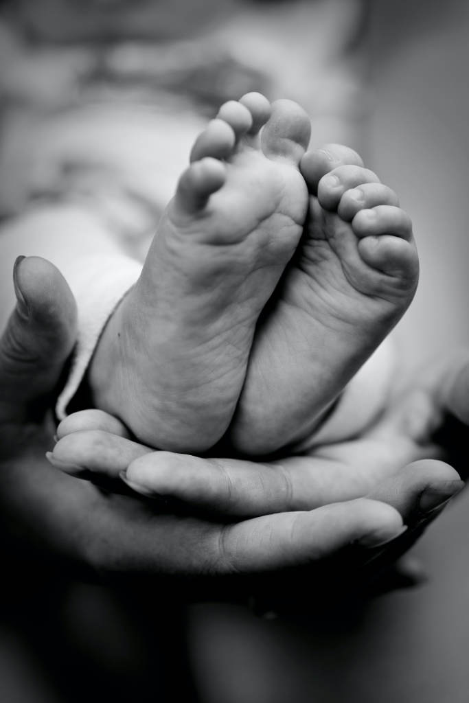 cradling baby feet