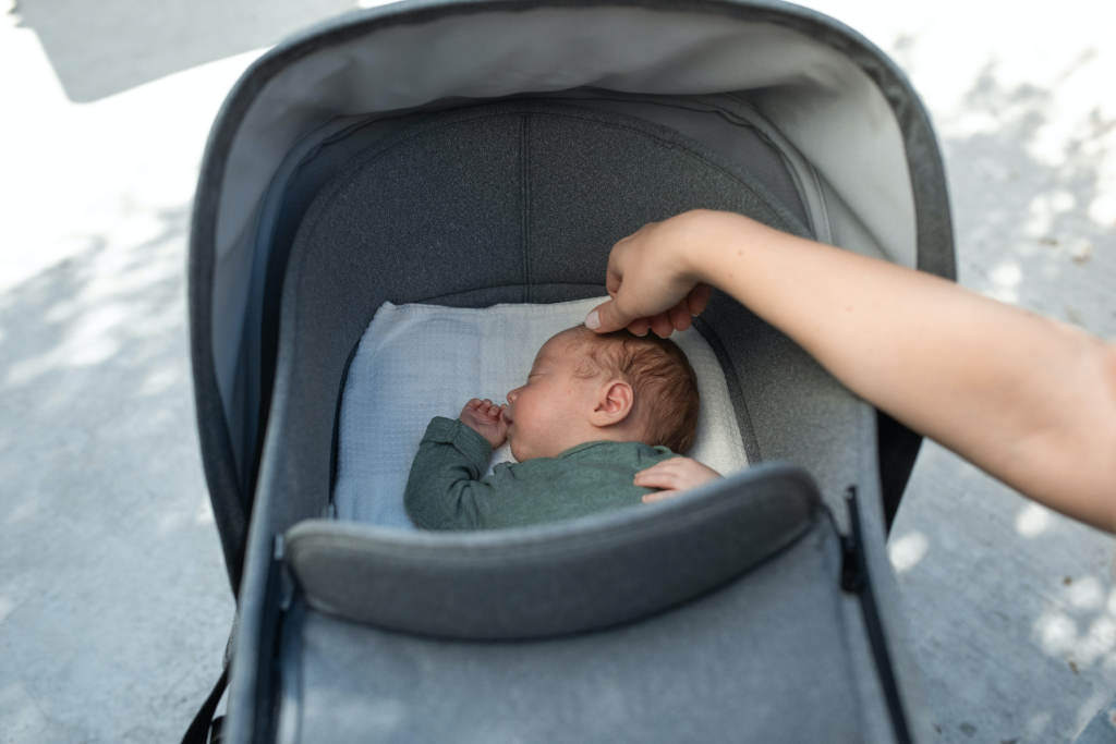 baby sleeping in stroller